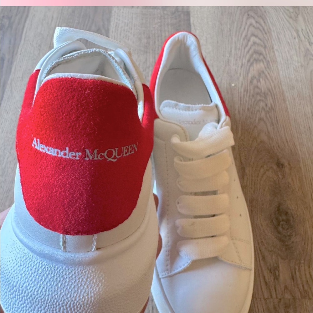 Designer kids Alexander McQueen shoes and Versace shirt
